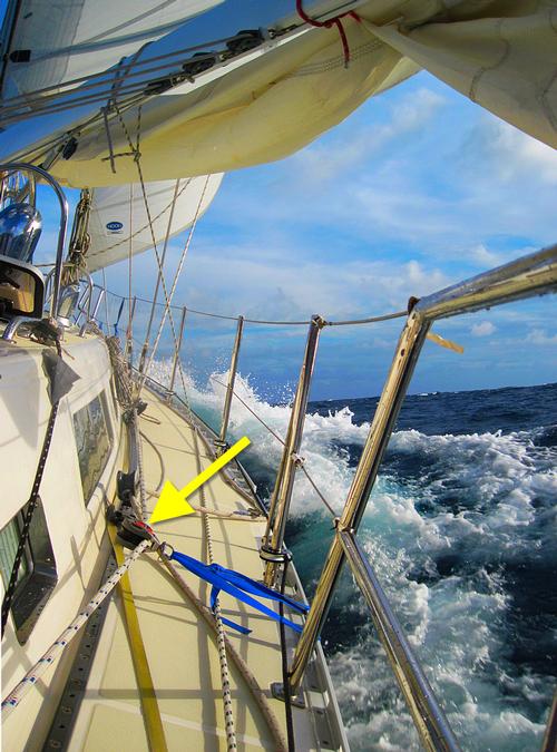 Protect your costly sailing sheets, halyards, anchor and docking lines from chafe. Note how this snatch block (yellow arrow) pulls the staysail sheet clear of potential chafe points on this cutter.  © Captain John Jamieson http://www.skippertips.com