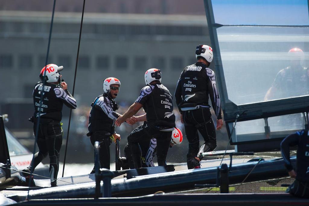 Emirates Team New Zealand sailors console each other after losing the final race of the America's Cup 34. 25/9/2013 © Chris Cameron/ETNZ http://www.chriscameron.co.nz