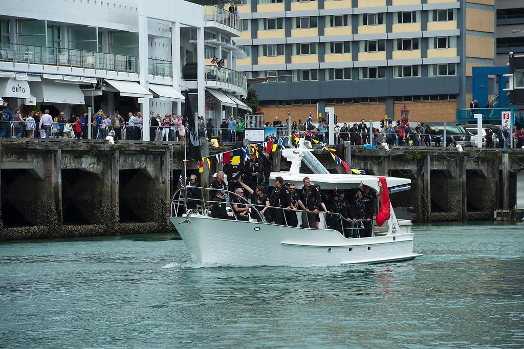 Emirates Team New Zealand welcome home event in Auckland. Team members wave to supporters lining the docks and The Viaduct from a flotilla. 4/10/2013 © Chris Cameron/ETNZ http://www.chriscameron.co.nz