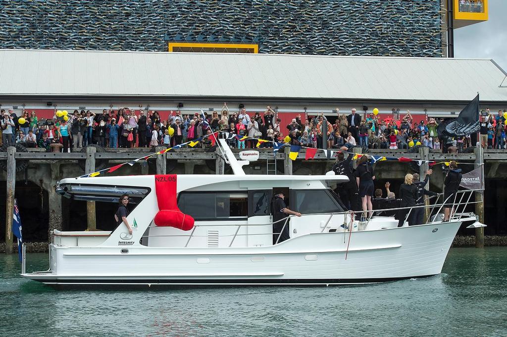 Emirates Team New Zealand welcome home event in Auckland. Team members wave to supporters lining the docks and The Viaduct from a flotilla. 4/10/2013 © Chris Cameron/ETNZ http://www.chriscameron.co.nz