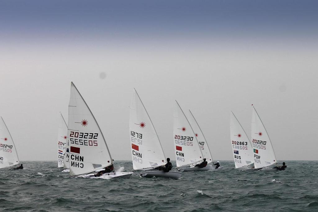 Laser fleet - 2013 ISAF Sailing World Cup Qingdao photo copyright ISAF  taken at  and featuring the  class