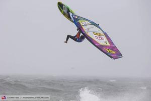 Ricardo Campello one-footed backloop - PWA Cold Hawaii World Cup 2013 photo copyright  John Carter / PWA http://www.pwaworldtour.com taken at  and featuring the  class