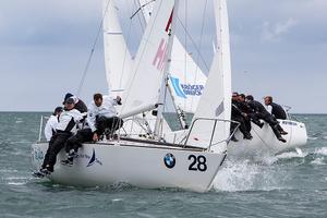 Tim Healy (left) and the crew of Helly Hansen from Sail Newport (USA) on their way to overall victory on the final day of the BMW J24 World Championships at Howth Yacht Club. photo copyright  David Branigan / ISAF http://www.sailing.org taken at  and featuring the  class