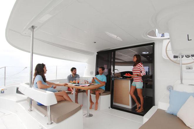 A larger opening between the cockpit and the saloon providing easy access to the galley on the Lipari 41 Evolution. The cockpit features a comfortable sofa and a pleasant place to enjoy the horizon. © Fountaine Pajot http://www.fountainepajot.com.au/