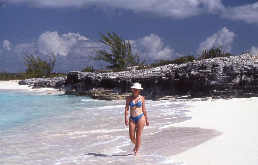 Slow down the pace, relax and enjoy where you are. Sheryl Shard strolling beach on Long Island, Bahamas. - 24 Years of Cruising - Lessons Learned photo copyright Sheryl Shard taken at  and featuring the  class