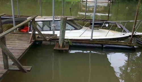 Photo of a submerged boat at a dock<br />
 © Vic Winebarger