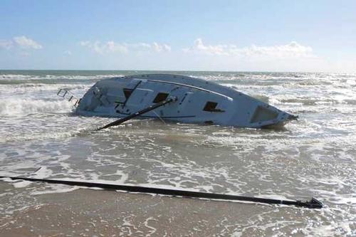 Photo of a sailboat capsize on the shoreline<br />
<br />
<br />
 © onEdition http://www.onEdition.com
