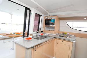 The Lipari 41 Evolution's new kitchen worktop in beautiful grey blends associated with a light-wood and opens directly into the cockpit dining area. The new drawer refrigerator offers a capacity of 144 litres. photo copyright Fountaine Pajot http://www.fountainepajot.com.au/ taken at  and featuring the  class
