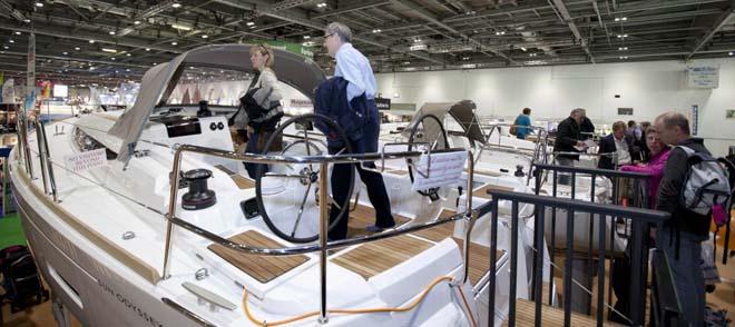 Visitors looking at the Sun Odyssey yachts on the Jeanneau stand at the London Boat Show 2014, ExCeL, London. © onEdition http://www.onEdition.com