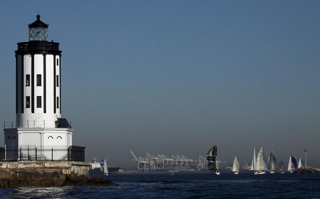 Standing as a sentinel, the LA Harbor Light marks the Los Angeles Harbor entrance as racing sailboats turn back towards Long Beach Harbor in the 2014 Two Gates Pursuit Race. - 2014 Two Gates Pursuit Race photo copyright Rick Roberts  taken at  and featuring the  class