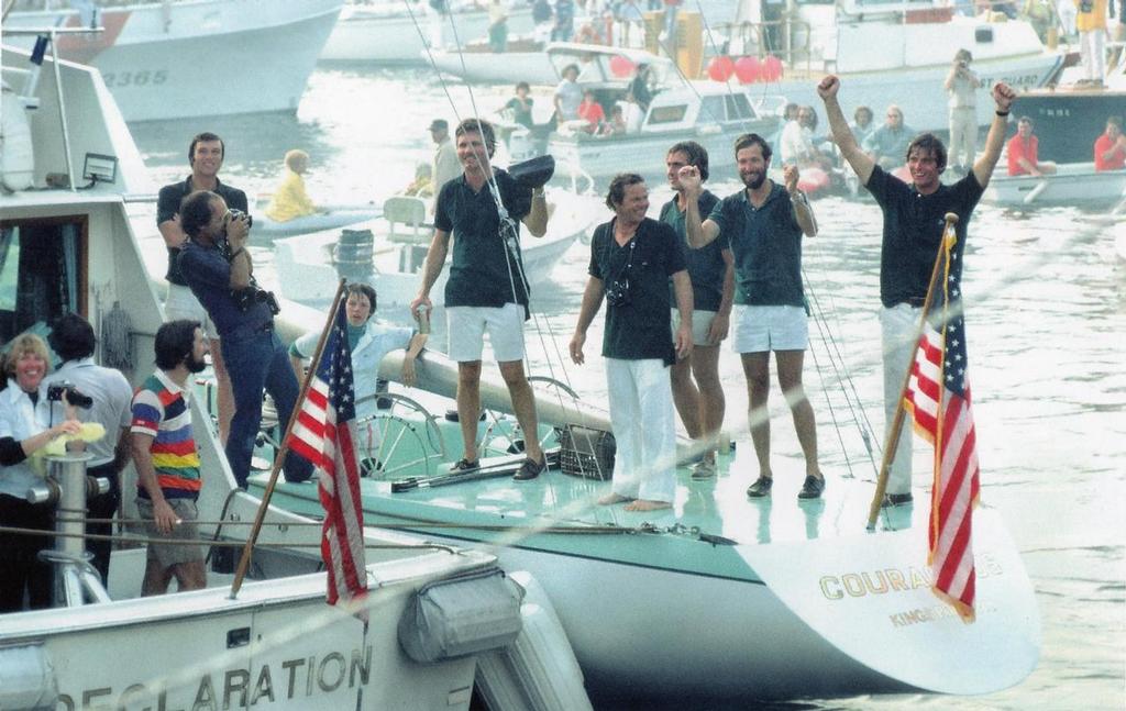 Flashback: Aboard Courageous, Gary Jobson raises his arms in triumph, while Ted Turner (holding cap) beams at the crowd after their 1977 America’s Cup win © Paul Darling Photography Maritime Productions www.sail-world.com/nz