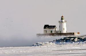 Lighthouse at Cleveland Harbour floats in the mist photo copyright  SW taken at  and featuring the  class