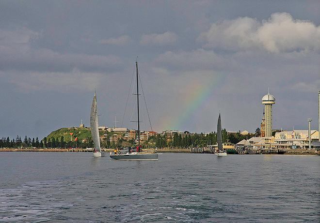 Rainbow frames Newcastle Harbour and local yachts ©  John Curnow