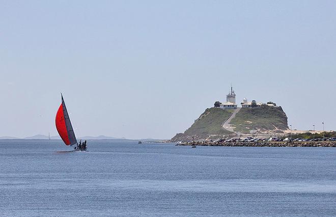 The yacht Spirit passes Nobbys on the way to sea. - 2014 Audi IRC Australian Championship ©  John Curnow