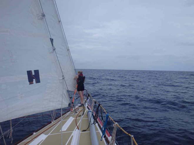 A crew member on the bow of PSP Logistics. - 2013-14 Clipper Round the World Yacht Race © Clipper Ventures