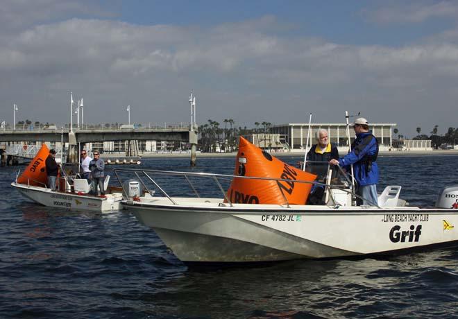 (right) Anton Hochschild and John Koenig work on setup for weather mark set boat while (left) Robert Curley, Kelly Dale and Mike Gehring work on getting ready to set a start line during LBYC’s Race Management Training Day. © Rick Roberts 