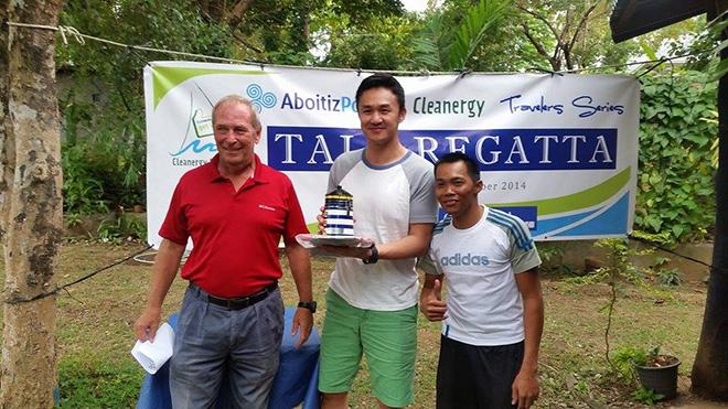 Tali Regatta- Hobie 16 Class Champs Mike Ngu and Lindo Pahayahay with PHINSAF President Jerry Rollin (and their chocolate-filled lighthouse trophy!) © Jose Sehwani Gonzales