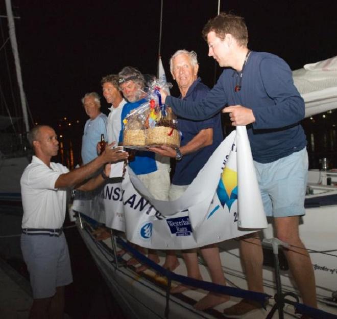 Warm welcome to the spice island of Grenada and a welcome basket of local goodies for the crew of Optim'X - RORC Transatlantic Race 2014. © RORC/Arthur Daniel and Orlando K Romain