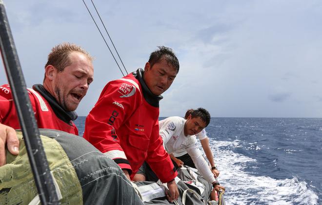 Leg two, Day 15 - Doldrums - Showers and wind shifts as the team onboard Dongfeng perform another manoeuvre  - Volov Ocean Race 2014-15. © Yann Riou / Dongfeng Race Team