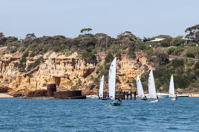 The hulk of Cerberus with the fleet departing the BRYC for the racecourse. - 2014 OK World Championships ©  Alex McKinnon Photography http://www.alexmckinnonphotography.com