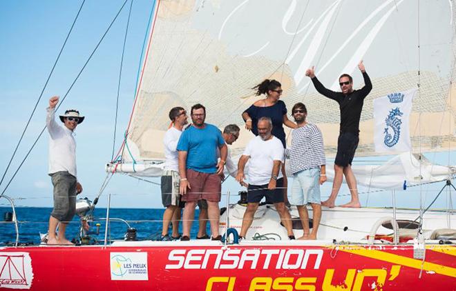 A jubilant crew on Sensation Class 40 celebrate their arrival  © RORC/Arthur Daniel and Orlando K Romain