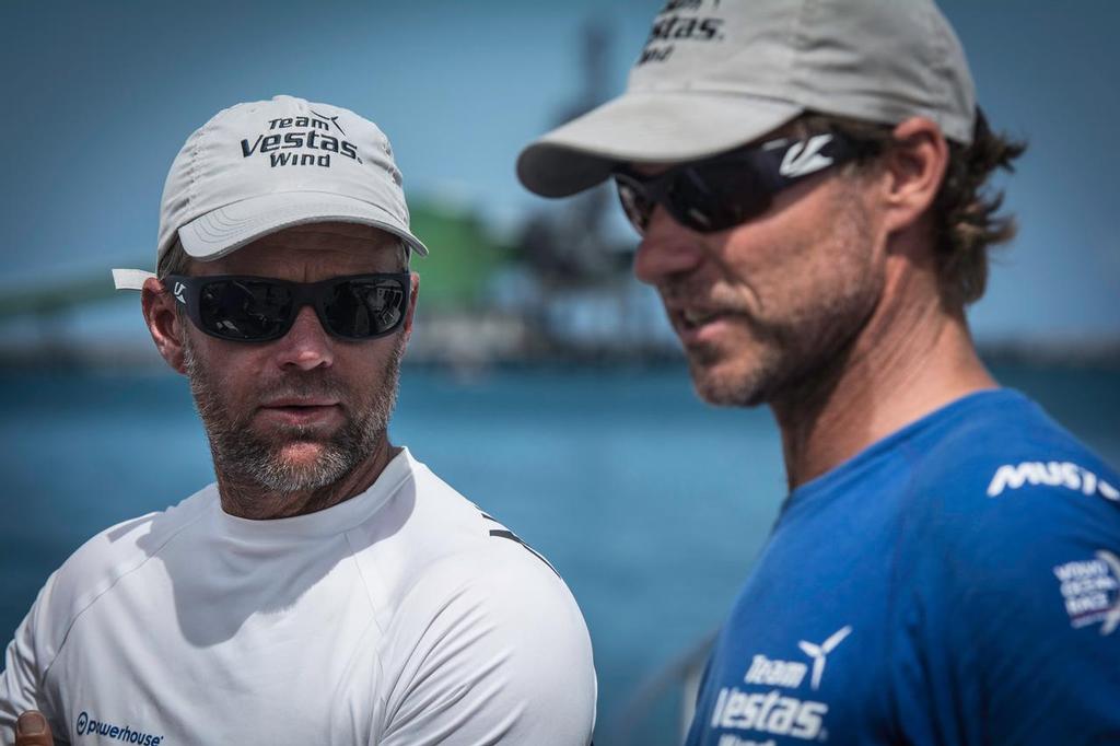 Shore crew manager Neil Cox (blue shirt) and skipper Chris Nicholson after . Team Vestas Wind crew arrives to Mauritius with all the equipment they rescued from the boat after grounding on the Cargados Carajos Shoals on the 29th November ©  Marc Bow / Volvo Ocean Race