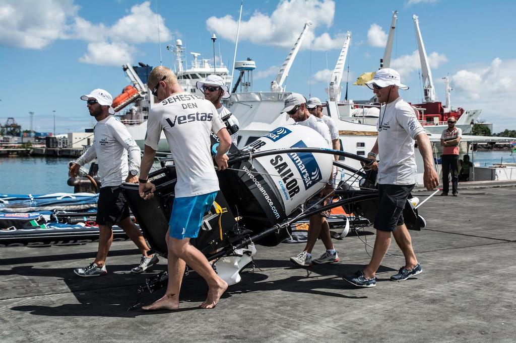 Team Vestas Wind crew the crew carries the Inmarsat satellite dome after arriving in Mauritius with all the equipment they rescued from the boat after grounding on the Cargados Carajos Shoals on the 29th November ©  Marc Bow / Volvo Ocean Race