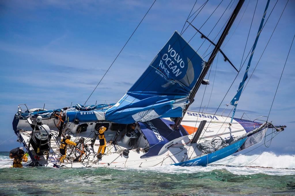November 30, 2014. Team Vestas Wind's boat grounded on the Cargados Carajos Shoals, Mauritius, in the Indian Ocean. Fortunately, no one has been injured. In this image, the crew head back to the boat to retrieve everything they can; including ropes, diesel, Inmarsat dome and sails. photo copyright Volvo Ocean Race http://www.volvooceanrace.com taken at  and featuring the  class