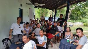 Sailors enjoying Edgy Veggy dishes (plus adobo and bonitos tuna from a different store) at a charming Tali B&B! photo copyright Jose Sehwani Gonzales taken at  and featuring the  class