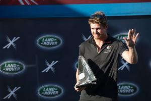 Olympic Gold Medallist Tom Slingsby with his Land Rover Above and Beyond Award presented in recognition of the greatest tactical performance and improvement seen this year on a debut appearance at the Extreme Sailing Series™. photo copyright Lloyd Images taken at  and featuring the  class