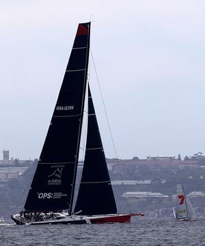 U.S. Maxi Comanche dwarfs the world champion 18ft Skiff Gotta Love It 7 on Sydney Harbour photo copyright Chris Part taken at  and featuring the  class