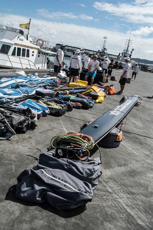 Team Vestas Wind crew arrives to Mauritius with all the equipment they rescued from the boat after grounding on the Cargados Carajos Shoals on the 29th November photo copyright  Marc Bow / Volvo Ocean Race taken at  and featuring the  class
