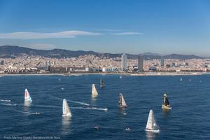 Sun and sons shine on light winds - Barcelona World Race 2014-15 start. photo copyright Martinez Studio taken at  and featuring the  class