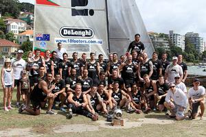 South Sydney Rabbitohs NRL Squad with the JJ Giltinan Trophy - JJ Giltinan 18ft Skiff Championship 2014 photo copyright Australian 18 Footers League http://www.18footers.com.au taken at  and featuring the  class
