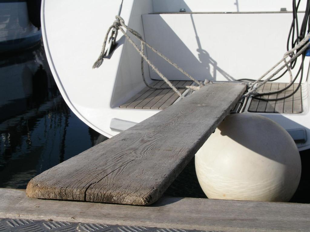 A simple wooden plank makes an acceptable boarding ramp or passerelle so you can get ashore when moored stern-to - Mediterranean Mooring - How to Moor Stern-to a Dock or Quay photo copyright Paul Shard taken at  and featuring the  class