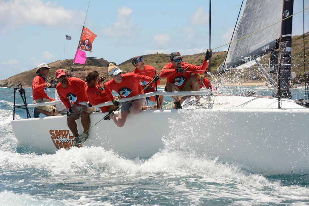 Riding the rail about Puerto Rico’s Jamie Torres’ Melges 32, Smile and Wave. © Dean Barnes