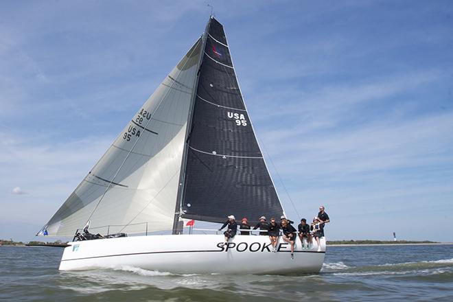 Olympic medalist Steve Benjamin’s all carbon-fiber 40-footer “Spookie” (Norwalk, CT) flies past Sullivan’s Island at 15 knots in the afternoon sea breeze at the finish of race three of 2014 Sperry Top-Sider Charleston Race Week. - Sperry Top-Sider Charleston Race Week 2014 © Meredith Block/ Charleston Race Week http://www.charlestonraceweek.com/