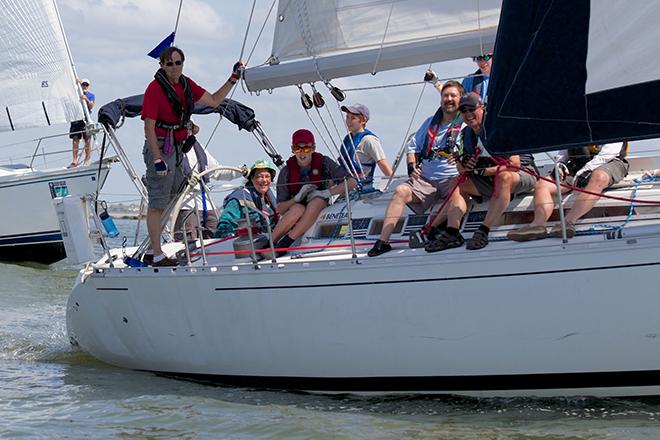 Family and friends make the most of the summer-like temperatures as cruising yachts from the Pursuit Class sail through the jetties. © Meredith Block/ Charleston Race Week http://www.charlestonraceweek.com/