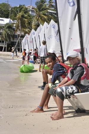 Optimist sailors wait on the beach at the St. Thomas Yacht Club for the signal to launch in the 2013 International Optimist Regatta. -  International Optimist Regatta photo copyright Dean Barnes taken at  and featuring the  class