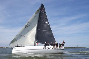 Olympic medalist Steve Benjamin’s all carbon-fiber 40-footer “Spookie” (Norwalk, CT) flies past Sullivan’s Island at 15 knots in the afternoon sea breeze at the finish of race three of 2014 Sperry Top-Sider Charleston Race Week. - Sperry Top-Sider Charleston Race Week 2014 photo copyright Meredith Block/ Charleston Race Week http://www.charlestonraceweek.com/ taken at  and featuring the  class
