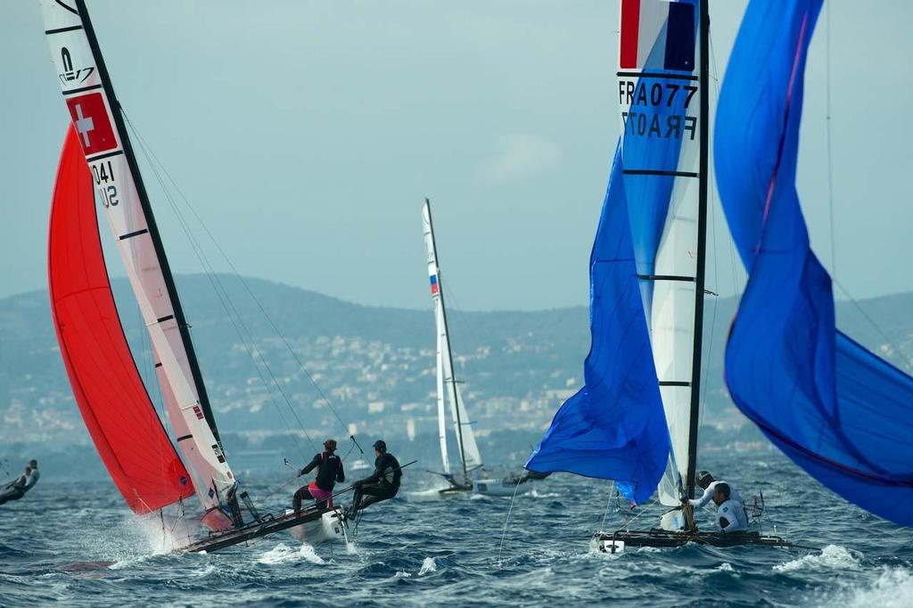 FRA 77 Franck Cammas and Sophie de Turckheim, SUI41 Matias Buhler and Nathalie Brugger, Nacra 17 - 2014 ISAF Sailing World Cup Hyeres, day 2 photo copyright  Franck Socha / ISAF Sailing World Cup Hyeres http://swc.ffvoile.fr/ taken at  and featuring the  class