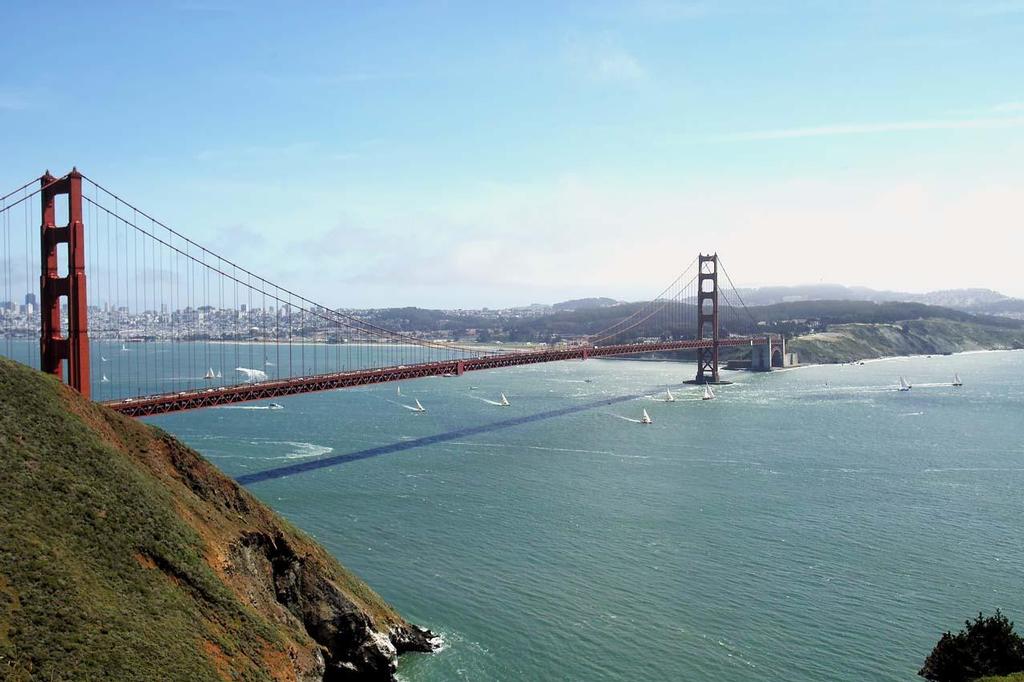 The fleet pass below San Francisco's Golden Gate Bridge as race 11 of the 2013-14 Clipper Round the World Yacht Race commences. photo copyright Chuck Lantz http://www.ChuckLantz.com taken at  and featuring the  class