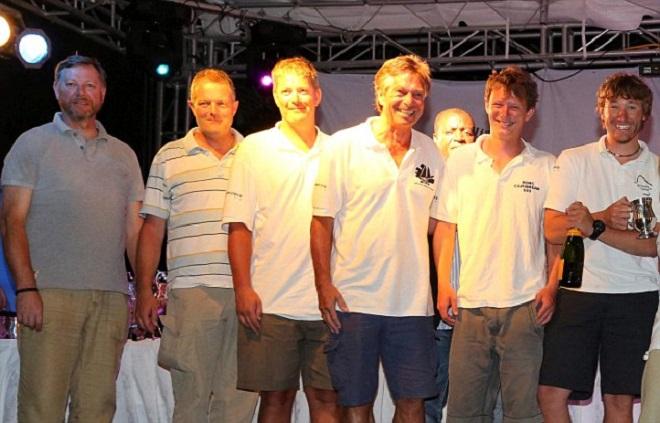 All smiles: The last picture of the crew of the Cheeki Rafiki shows the sailors enjoying an awards ceremony at the end of the Antigua Sailing Week 2014. Steve Warren is shown left, Paul Goslin, is second left, Andrew Bridge is seen second to right, and James Male is pictured right.  © MailOnline