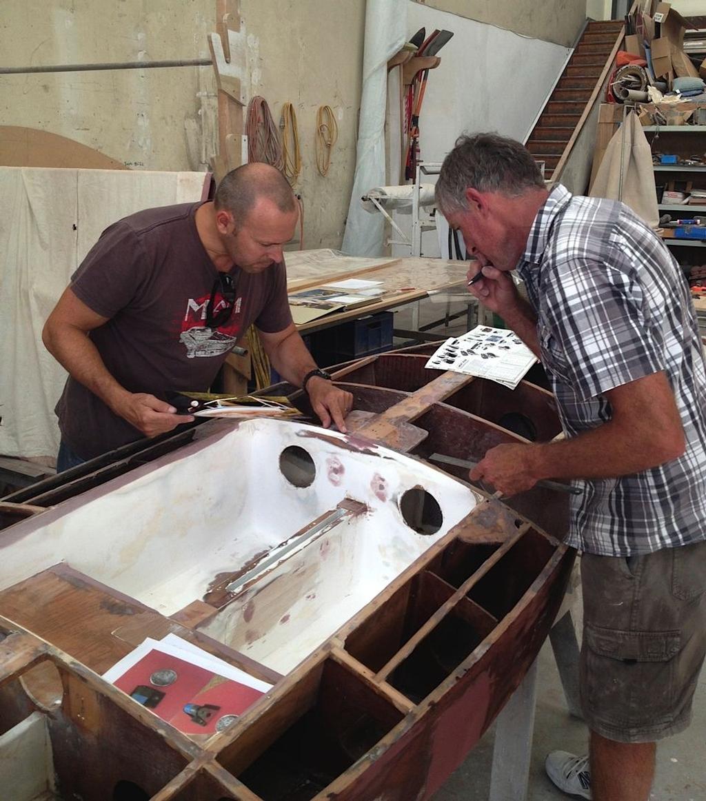 Geoff Senior helping Mike Pearce with the positioning of the deck fittings © Ray Barker