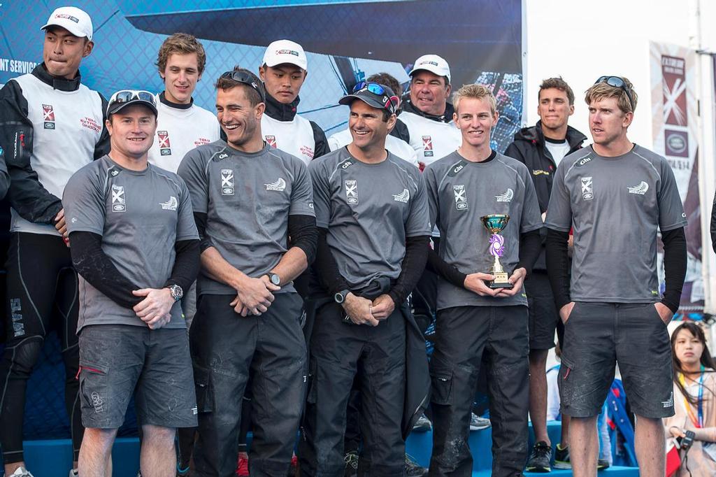 Emirates Team New Zealand sailors, Glenn Ashby, Blair Tuke, Jeremy Lomas, Edwin De Latt and Peter Burling on stage at the prize giving to receive the third place trophy for the Land Rover Extreme Sailing Series regatta in Qingdao, China. 4/5/2014 photo copyright Chris Cameron/ETNZ http://www.chriscameron.co.nz taken at  and featuring the  class