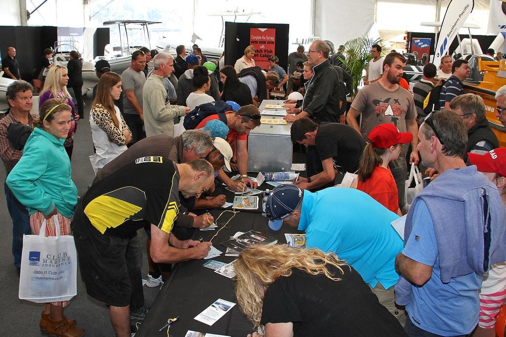 Eyes Down! Filling out entry forms - Hutchwilco NZ Boat Show 2014 © Richard Gladwell www.photosport.co.nz