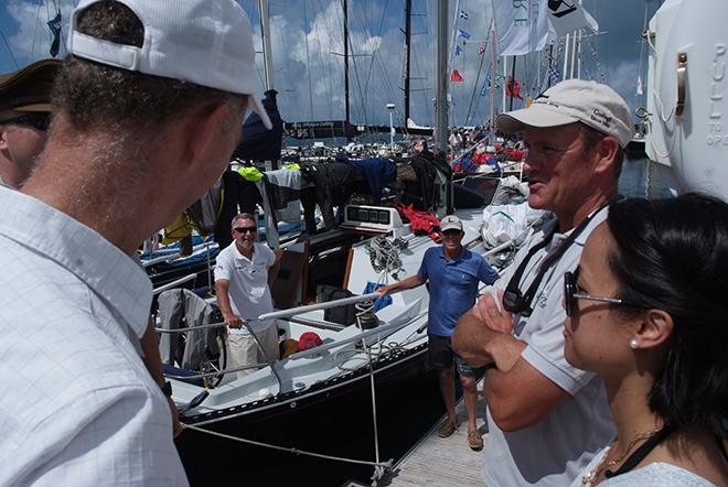 His Excellency the Governor of Bermuda, George Fergusson, meets with the crew of Eliminator, a J120 from Grosse Pointe Park, MI, during a tour of the race yachts in the marina. © Barry Pickthall / PPL