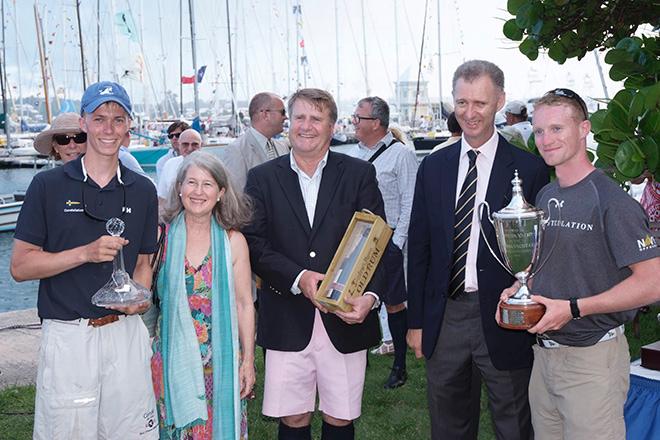 His Excellency the Governor of Bermuda Mr. George Fergusson in tie, his wife Mrs Fergusson and Malcolm Gosling present US Naval Academy yacht Constellation skippered by Midshipman Josh Forgacs (right) and crewman Charlie Morris (left) with first prize, after winning the Royal Bermuda YC The Anniversary Regatta. © Barry Pickthall / PPL