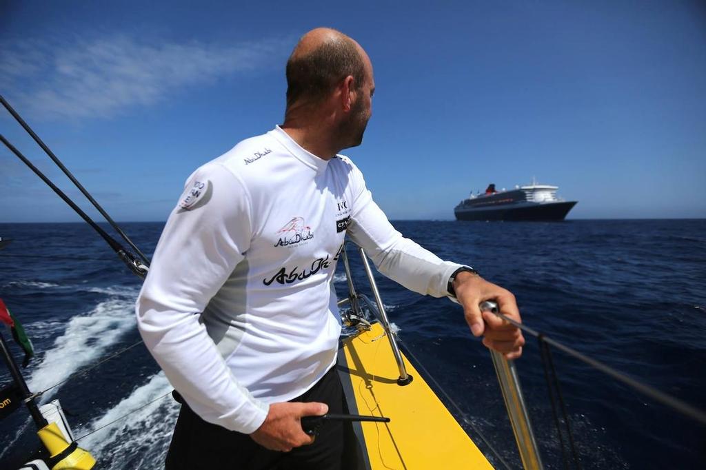 Skipper Ian Walker looks back as Queen Mary 2 approaches Azzam photo copyright Abu Dhabi Ocean Racing taken at  and featuring the  class