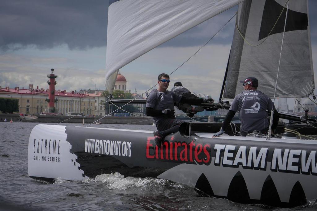 Emirates Team New Zealand sailor Jeremy Lomas talking to the chase boat during practice racing of Act 4 of the Extreme Sailing Series in St Petersburg, Russia photo copyright Hamish Hooper/Emirates Team NZ http://www.etnzblog.com taken at  and featuring the  class